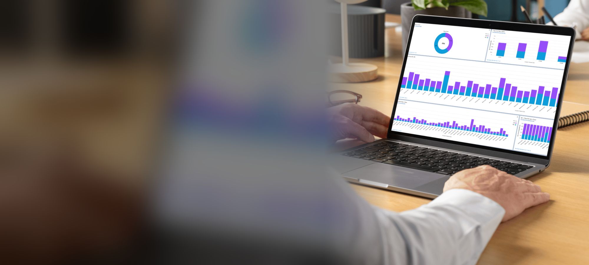 Professional analyzing CRM data on a laptop